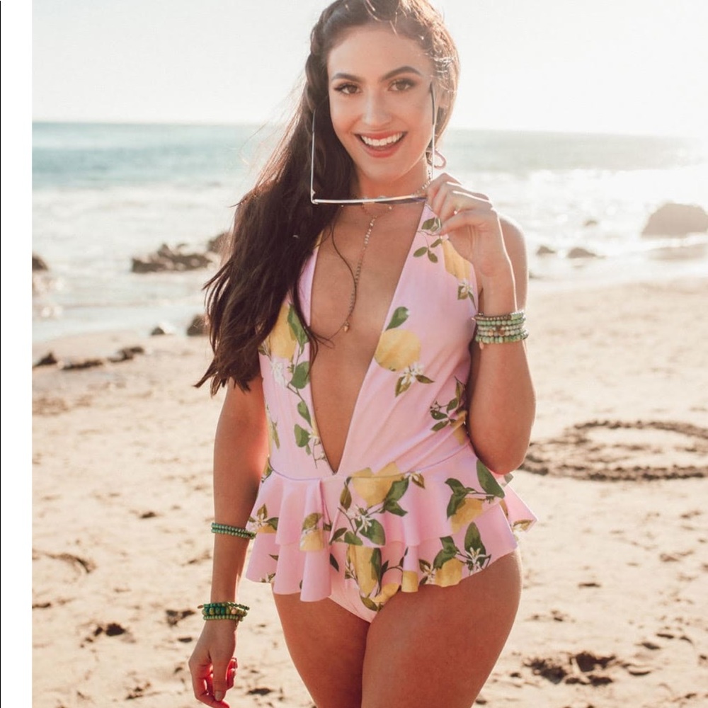 Lemon one piece bathing suit. Offers welcomed